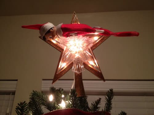 Elf on the Shelf Planking on the Christmas Tree Star