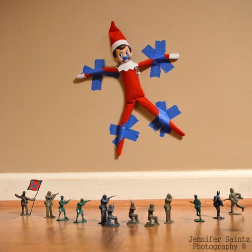 Elf on the Shelf Held Hostage by a Shooting Squad