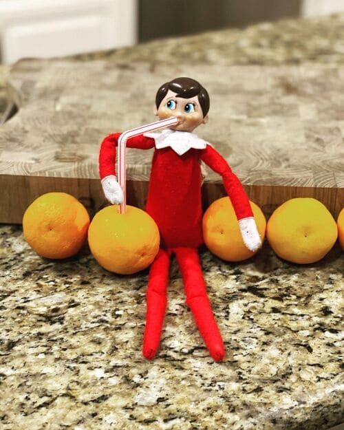 Elf on the Shelf Drinking Orange Juice