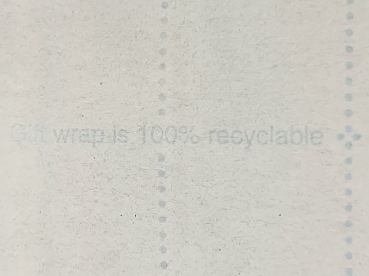 One tip that's both environmentally conscious and wallet-friendly is to look for recyclable gift wrap.