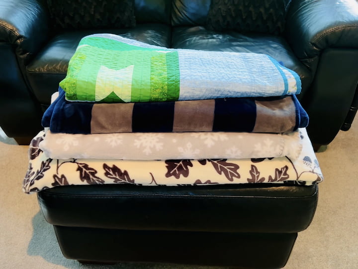 Keep spare blankets readily accessible in your living room and bedroom for quick warmth whenever needed.