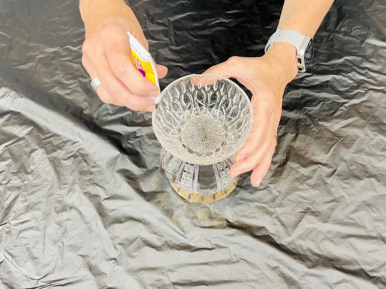 Add glue to the bottom of the vase and place a bowl on top.