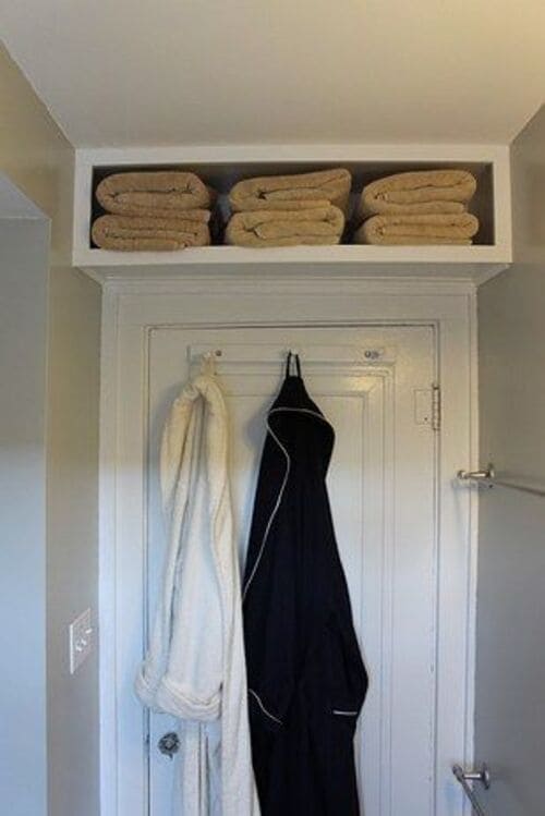 An Extra Shelf Over The Top of Your Bathroom Door