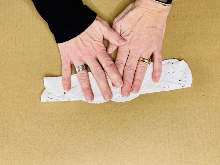 Accordion Folding: Take one doily, preferably the largest size, and fold it like an accordion. Fold it back and forth until the entire doily is neatly folded.