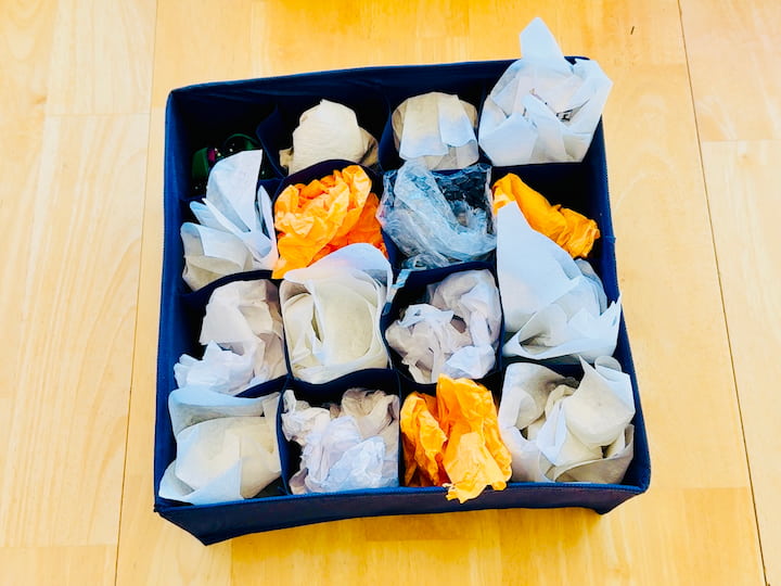 wrapped ornaments in dollar store drawer organizer