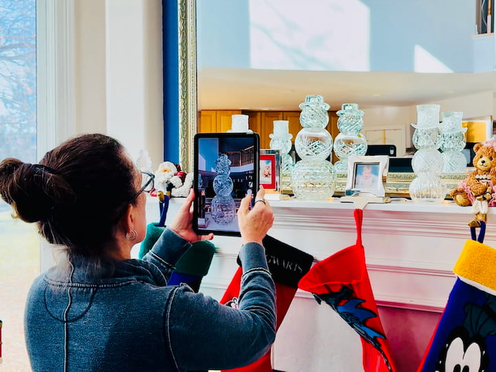 Chas taking picture of holiday decorations for digital filing