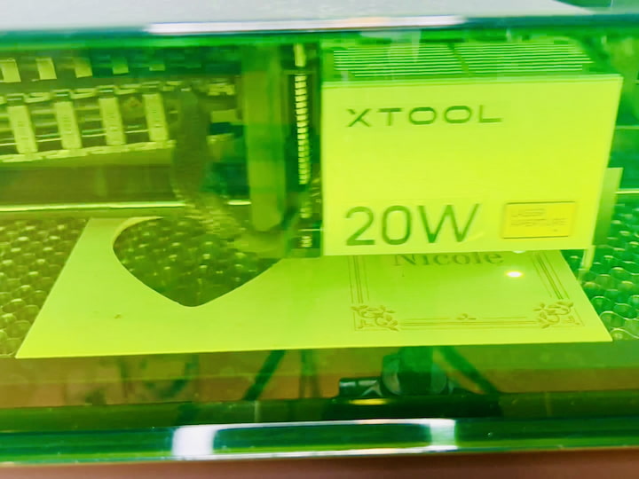 Step 6: Start the Laser Engraving Process Switch on the laser cutter, and let it work its magic. The machine will start with the outside perimeter and, interestingly, choose its own order for the subsequent tasks. In this case, it moved on to engraving the text from top to bottom.