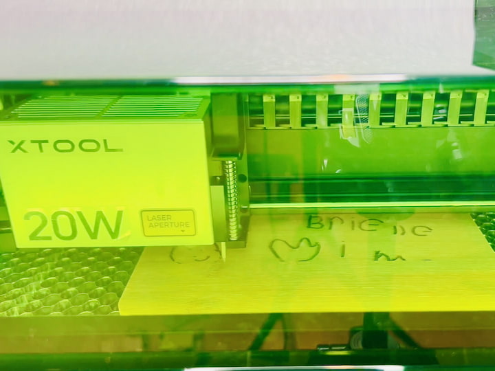 Step 6: Start the Engraving Process Turn on the X Tool S1 laser cutter and let it do its magic. The machine will follow the parameters set up in the software and start engraving the photo onto the bamboo cutting board. In this case, it started from the top and worked its way down.