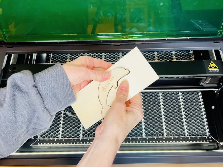 Step 8: Clean Up Once the engraving and cutting are complete, open the machine lid and carefully remove the wood ornament. Gently clean up any excess material to reveal your beautifully crafted laser-engraved project.