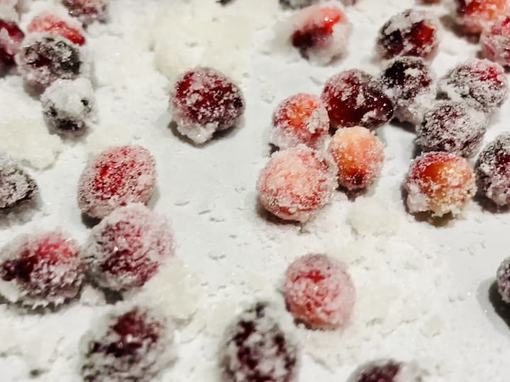 Lay out the sugar-coated cranberries on a baking sheet lined with wax paper or parchment paper. Let them dry for at least 2 hours, or ideally, overnight. This ensures that the sugared cranberries develop a satisfying crunch.