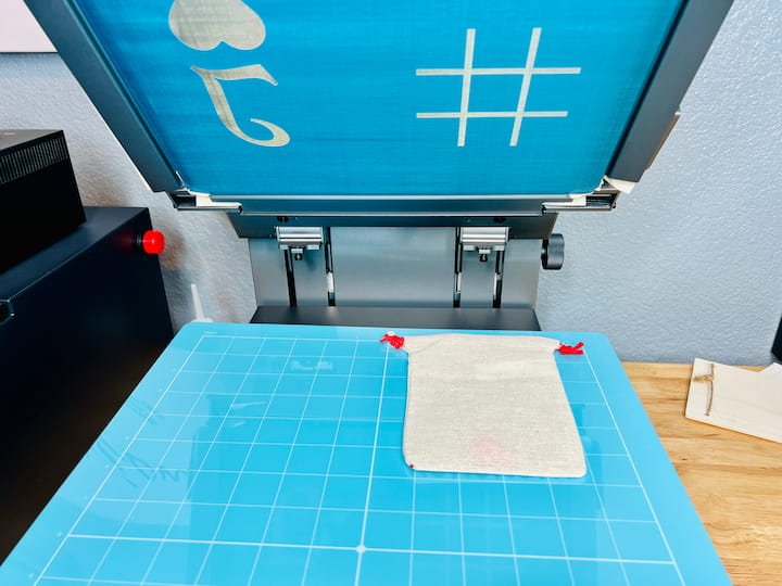 I assembled the xTool screen printer following the directions and placed my pouch under the design.