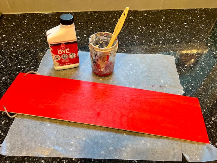 I created a custom design in xTool Creative Space for my sign. I painted the sign with Folk Art Ultra Dye, and let it dry. I screen printed the design on the sign.