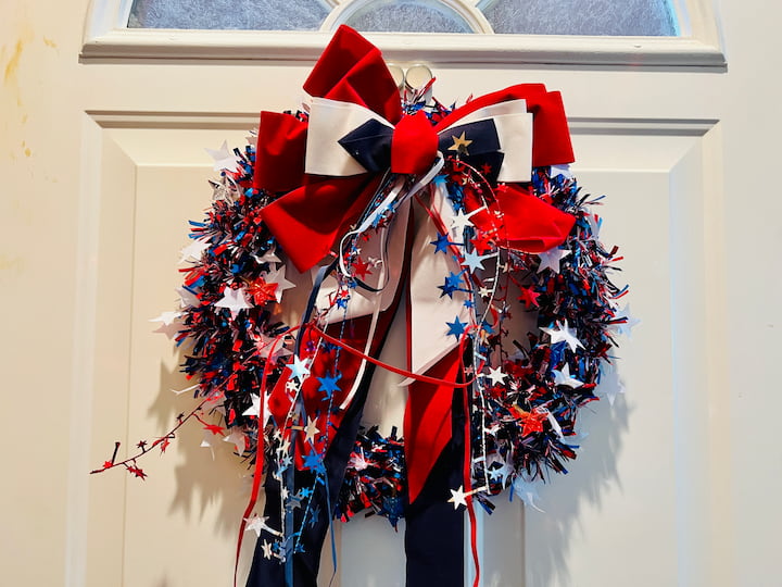 final patriotic wreath hanging on front door