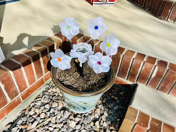  The two smaller flower pots on my entryway of DIY yard art. 