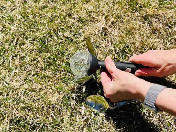 Attaching spoons to solar light with gaffers tape