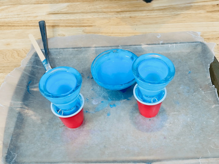  I set the candle holder upside down to drain in the little cup. And just like before, after about 10 minutes, I flipped them over.