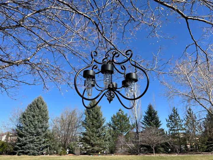 I hung it in a tree. Here is an important tip. I needed to make sure that the chain was long enough so that it would get enough sunlight during the day under tree branches to glow at night.