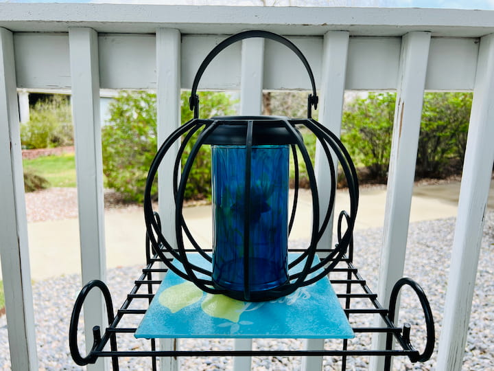 I'm going to leave solar light here on my front porch, but I could hang it up because it does have a handle. I love that this paint can be used outside.