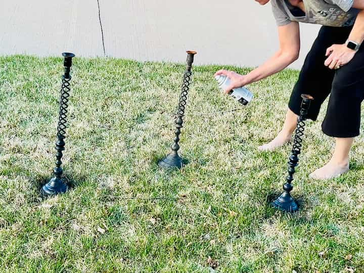 I started by washing them, cleaning them all up, and letting them dry. Then I spray painted them all with some Rustoleum spray paint that was good for outdoors.