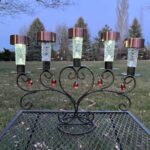 solar candle holder glowing at night