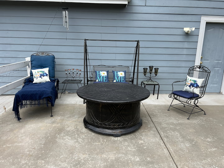 summer decor on patio with firepit and patio furniture