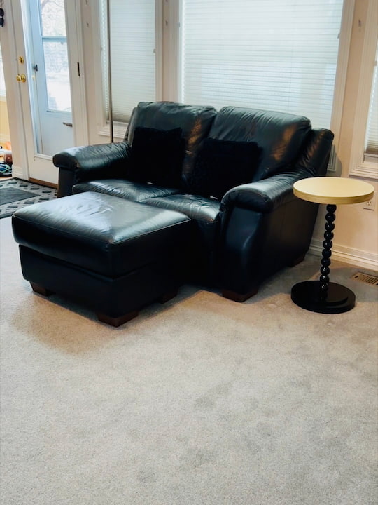 I placed the table next to our love seat. I think the black and gold ties in nicely with the couch and living room decor. 