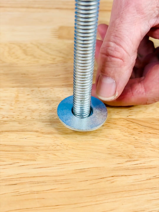 Now was time to start assembling the end table. We put a nut on a threaded rod and added a washer.