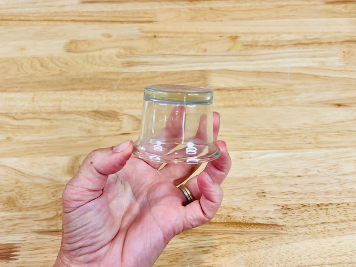 glass votive holder flipped upside down for snowman hat