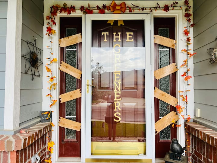 Now, I initially thought I was going to put my little boards up on different windows, but I changed my mind. So I cut all of the boards in half, adding more zigzags to the ends. And I placed these boards on the side windows by my entryway door. I thought this would be a cuter way to see them visually for all the trick or treaters when they come up. So I added four boards to each side of my doorway. Let me know what you think in the comments below.