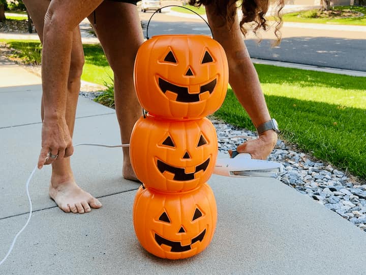 I started by stacking all the pumpkins on top of each other and then I hot glued them into place.