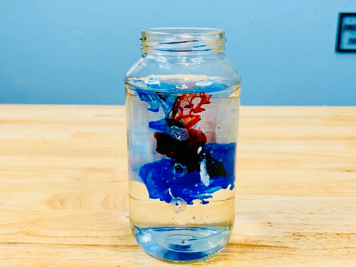 For this one I'm going to use a jar, and I'm going to fill it up with water. And I'm going to use the color blue and red. 