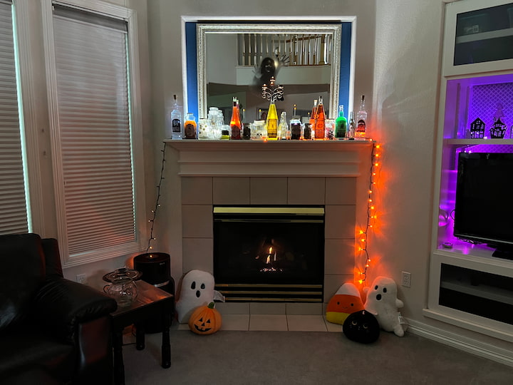 Here is the photo of my Halloween mantel lit up in the evening from a distance.