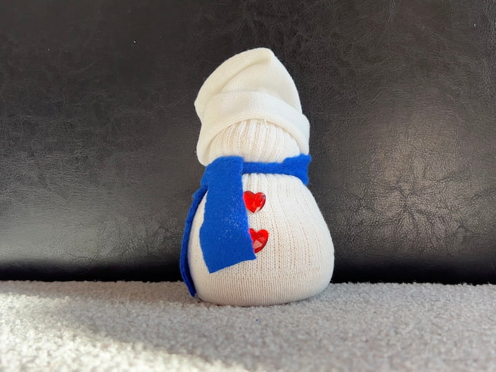 Add the hat and scarf to the sock snowman