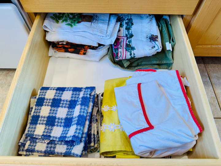 kitchen towels and aprons in drawer