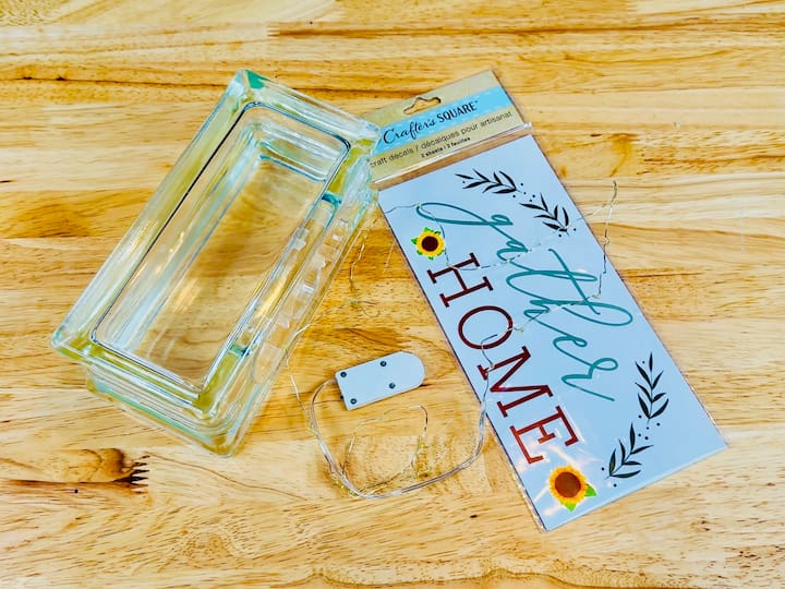 materials glass block, battery operated lights and stickers