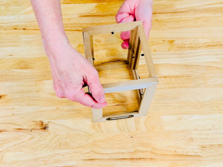 Glue the frames together in a square or lantern shape