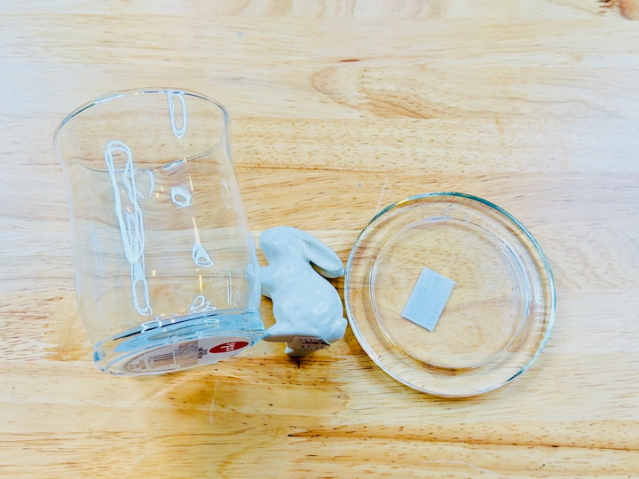 Materials need for this easy craft - flat candle holder, glass candle holder, ceramic bunny, foliage