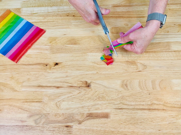 cutting the tissue paper into squares