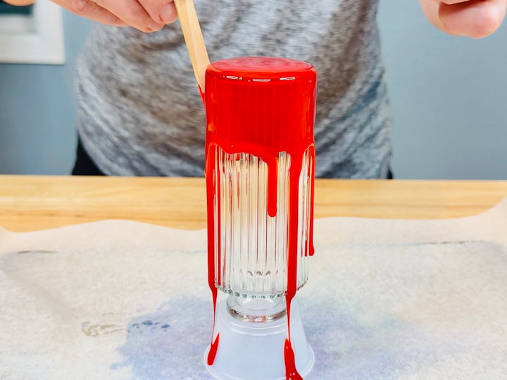 pouring the glue mixture onto the bottle