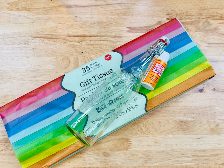 tissue paper, mod podge and glass bottle