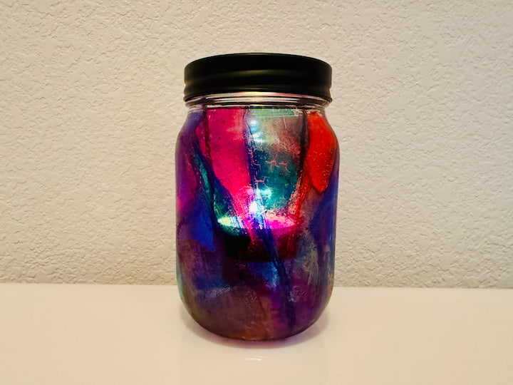faux stain glass candle holder during the daylight