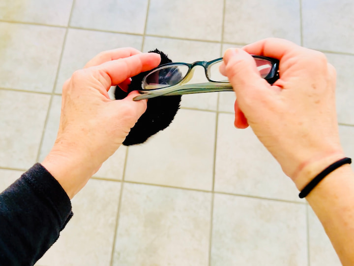 Chas sliding glasses into a sock