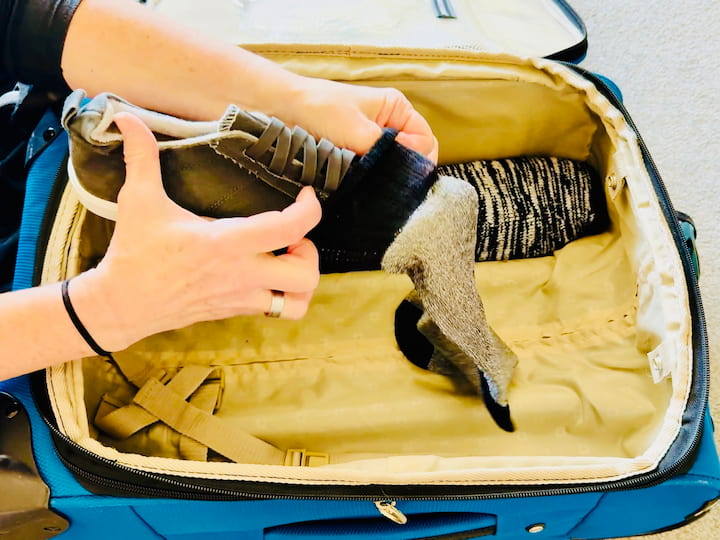 Chas covering shoes with a sock
