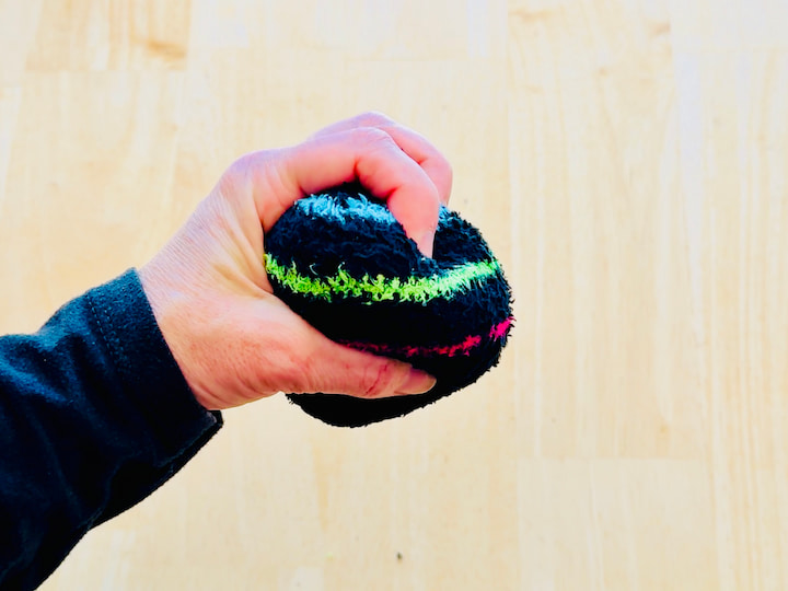 Chas squeezing the sock stress ball