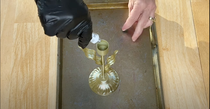 adding glue to candle holder