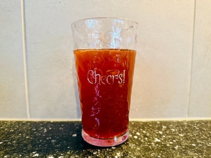 Engraved plastic cup with tea in it