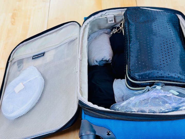 Laundry basket in pocket in suitcase
