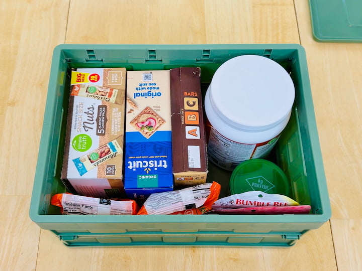 Collapsible crate filled with food and snacks