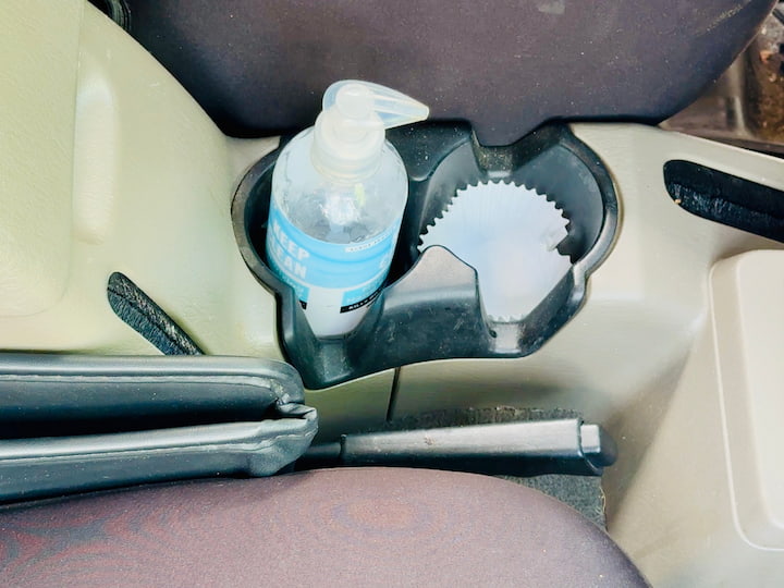 hand sanitizer in a cup holder