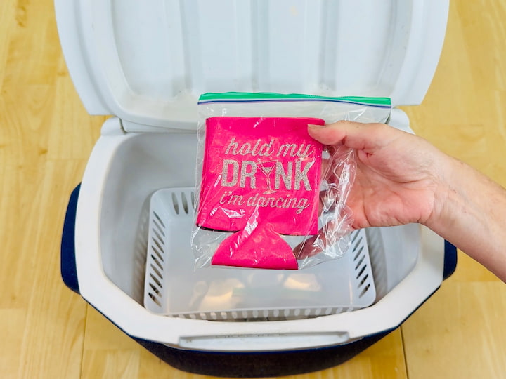 Add a drink koozie inside a sealed bag so it stays dry and ready to use.